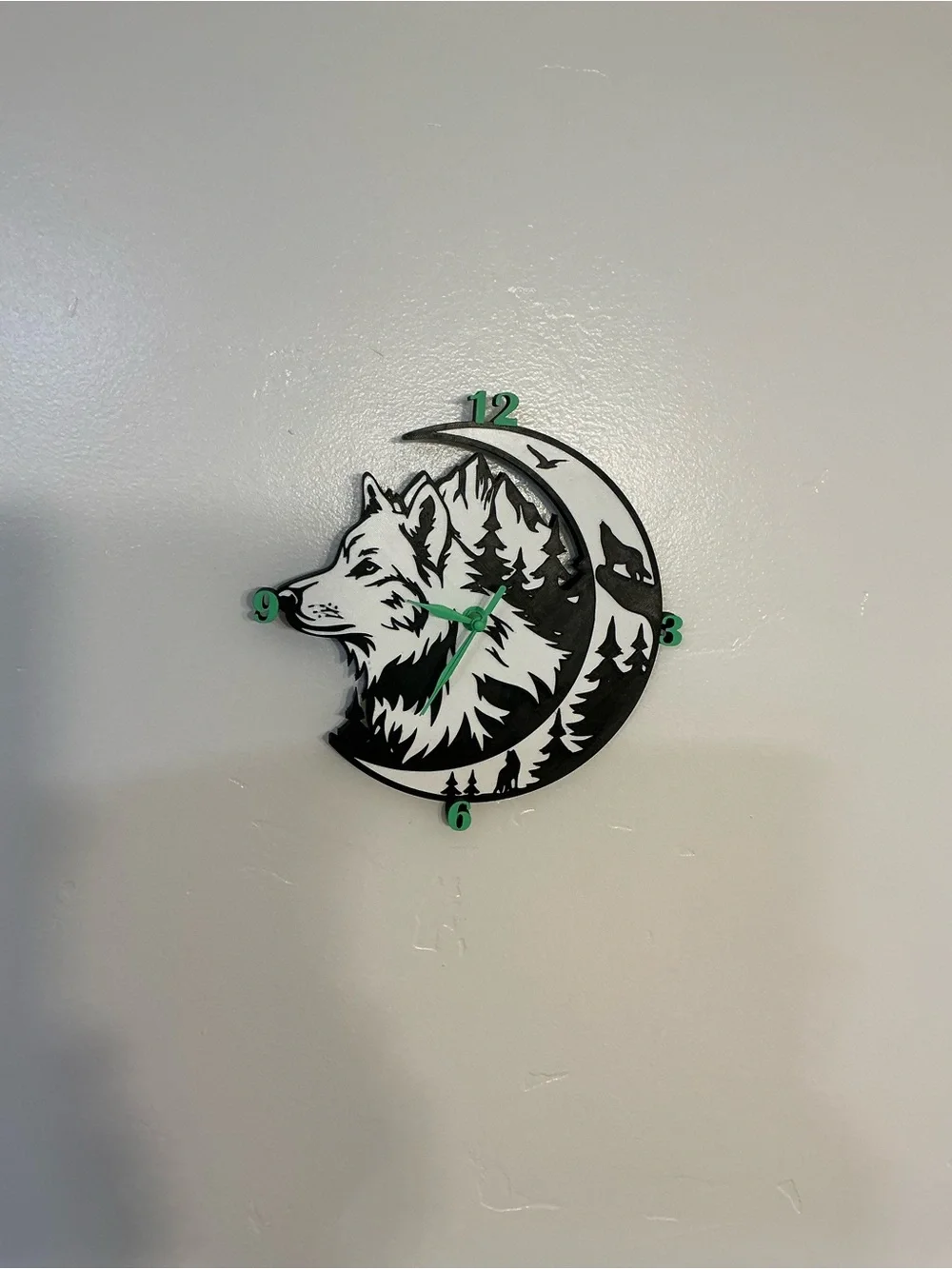 Wolf Moon Black and White Wall Clock with Green Accents